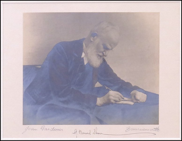 PHOTOGRAPH OF GEORGE BERNARD SHAW (BRITISH, 1859-1930).: PHOTOGRAPH OF GEORGE BERNARD SHAW (BRITISH, 1859-1930). By "Joan Gardiner" signed LL. Signature "G. Bernard Shaw" LC. Signed illegibly LR Sight: 9.25'' x 12'' Frame: 16'' x 19''