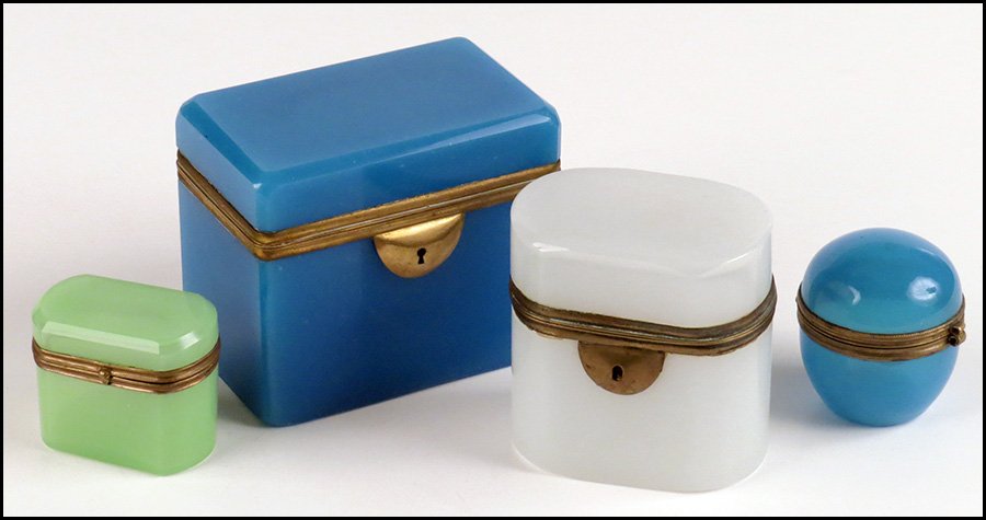 FOUR OPALINE HINGED-LID BOXES.: FOUR OPALINE HINGED-LID BOXES. Consisting of a rectangular blue, an oval shaped white, a smaller oval shaped green, and a smaller spherical shaped blue Largest: 4"x4.5"x3"
