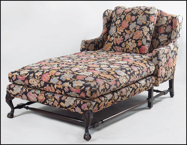 UPHOLSTERED MAHOGANY CHAISE LOUNGE.: UPHOLSTERED MAHOGANY CHAISE LOUNGE. Bearing ball and claw feet and floral upholstery Back H: 42.5'' x L: 77'' x W: 41''