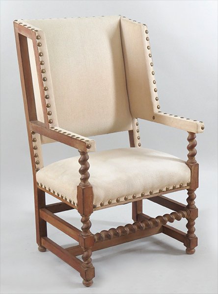 UPHOLSTERED JACOBEAN STYLE ARMCHAIR.: UPHOLSTERED JACOBEAN STYLE ARMCHAIR. Bearing nailhead trim and barleytwist supports Back H: 46''