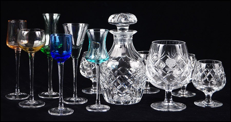 CARTIER CRYSTAL BRANDY SET.: CARTIER CRYSTAL BRANDY SET. Together with a promotional brandy snifter etched 'Old Elm' and six blown cordial glasses of various shapes and colors. Brandy set is comrpised of a Cartier decanter and fo