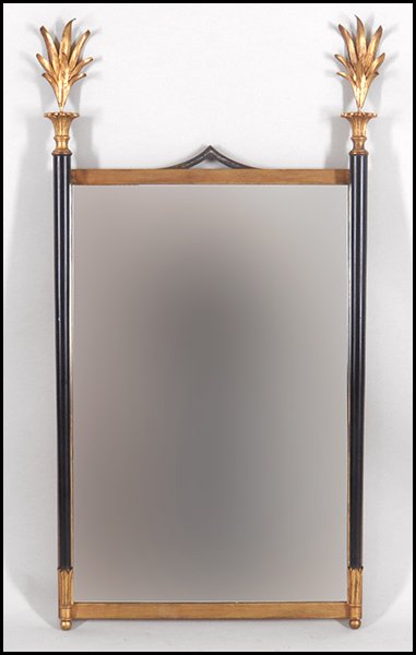 PALLADIO GILT AND EBONIZED WOOD MIRROR.: PALLADIO GILT AND EBONIZED WOOD MIRROR. Bearing a metal foliate top and pointed finials. 'Palladio' label en verso H: 39'' L: 26''
