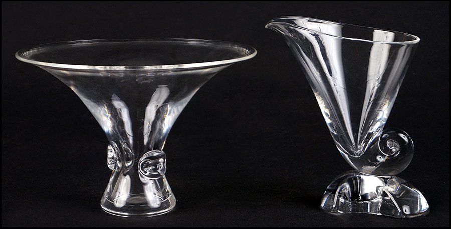 TWO STEUBEN ART GLASS VASES.: TWO STEUBEN ART GLASS VASES. One nautilus vase and one bouquet vase designed by George Thompson. Both signed 'Steuben' on undersides Nautilus: 7.5" x 6.5" Bouquet: 6.25" x 9.25"