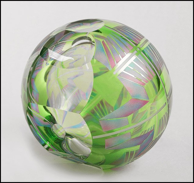 DAVID SCHWARZ (AMERICAN, B. 1952) ART GLASS SCULPTURE.: DAVID SCHWARZ (AMERICAN, B. 1952) ART GLASS SCULPTURE. Hand blown green glass sphere that is cut, etched, and painted in a geometric design. Underside bears artist's signature and date 8-11-03 Diamete
