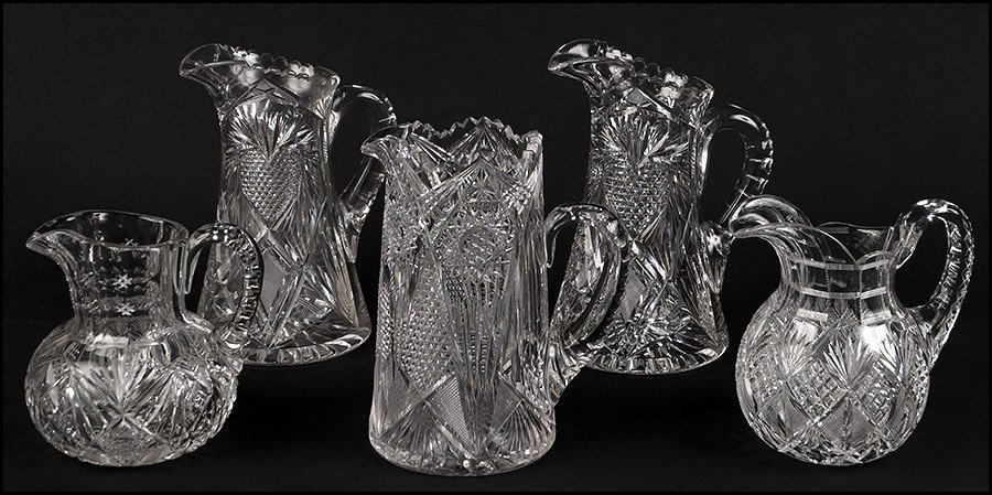 COLLECTION OF BRILLIANT CUT GLASS TANKARDS AND PITCHERS: COLLECTION OF BRILLIANT CUT GLASS TANKARDS AND PITCHERS. Consisting of a signed 'Hawkes' pitcher (7"), a signed 'J. Hoare Corning' tankard, a pair of unsigned tankards with a heart pattern (10"), and 