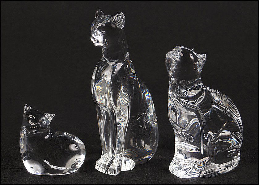 GROUP OF THREE CRYSTAL CATS.: GROUP OF THREE CRYSTAL CATS. Comprised of two Baccarat cats and one Waterford cat Tallest cat H: 6.5''