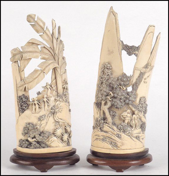 PAIR OF CARVED IVORY FIGURES IN A LANDSCAPE.: PAIR OF CARVED IVORY FIGURES IN A LANDSCAPE. 19th century H:11"