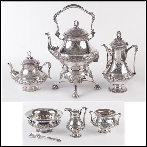 GERMAN SILVER TEA AND COFFEE SERVICE.: GERMAN SILVER TEA AND COFFEE SERVICE. Each piece is stamped "C. Becker". Service comprised of a coffee pot, a teapot, a hot water kettle on stand, a creamer, a sugar bowl, a waste pot, and a sugar sho