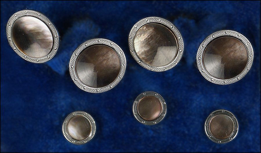 ABALONE AND GOLD DRESS SET.: ABALONE AND GOLD DRESS SET. Comprised of a pair of cufflinks and three shirt studs. In a fitted case