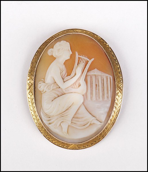 SHELL CAMEO AND 14 KARAT YELLOW GOLD BROOCH.: SHELL CAMEO AND 14 KARAT YELLOW GOLD BROOCH. 2" x 1.5"