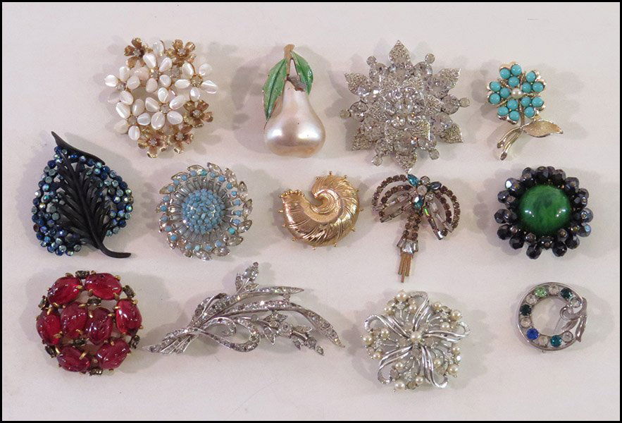 COLLECTION OF SIGNED BROOCHES.: COLLECTION OF SIGNED BROOCHES. Comprised of brooches by Weiss, STAR, Karu, Jeanne, Corocraft, Grosse, J.J., Phyllis, Sarah Coventry, Capri, Trifari, and a Van Dell sterling silver and rhinestone wreat