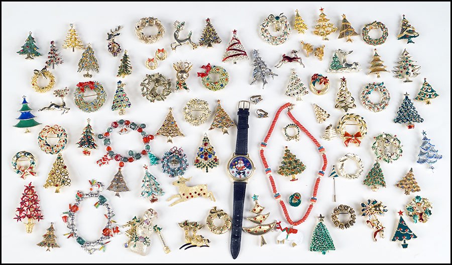 COLLECTION OF CHRISTMAS PINS.: COLLECTION OF CHRISTMAS PINS. Comprised of Christmas trees, wreaths, reindeer, and others. Makers include Eisenberg Ice, Gerry's, Art, Kirk's Folly, and others
