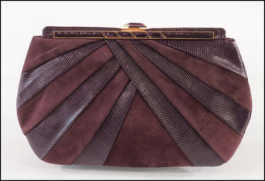 JUDITH LEIBER PURPLE SUEDE AND LIZARD CONVERTIBLE: JUDITH LEIBER PURPLE SUEDE AND LIZARD CONVERTIBLE HANDBAG / CLUTCH. Bearing a clasp closure. Together with a Judith Leiber coin purse and mirrored compact H: 8'' L: 13''