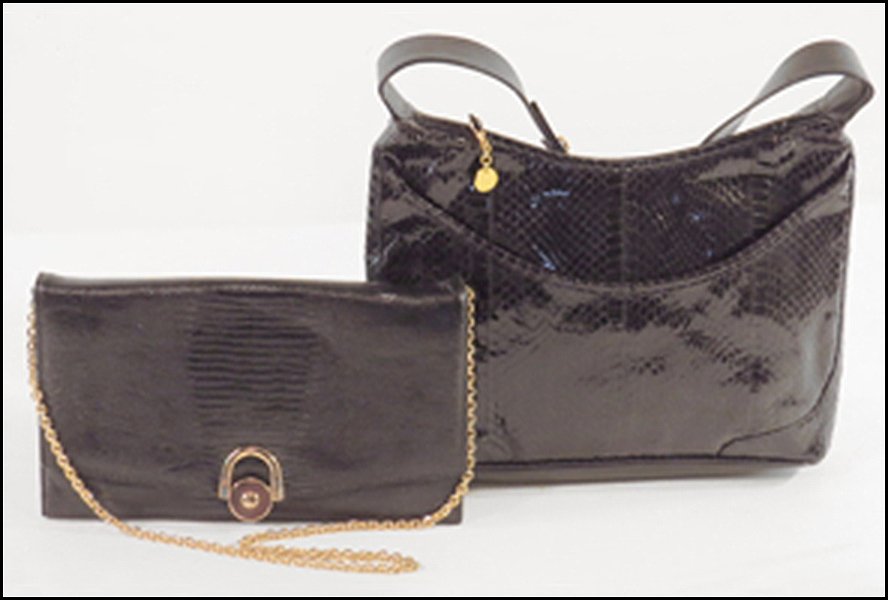 SAKS FIFTH AVENUE BLACK SNAKESKIN HANDBAG.: SAKS FIFTH AVENUE BLACK SNAKESKIN HANDBAG. Made in Hong Kong. Together with a Caprice black lizard skin handbag with a single strap Snakeskin bag: 9'' x 12''