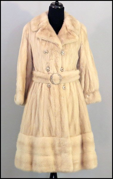 BLUSH MINK THREE-QUARTER LENGTH SWING COAT.: BLUSH MINK THREE-QUARTER LENGTH SWING COAT. With rhinestone buttons and a self belt with a rhinestone bucket. Labeled Thorpe Size 2/4