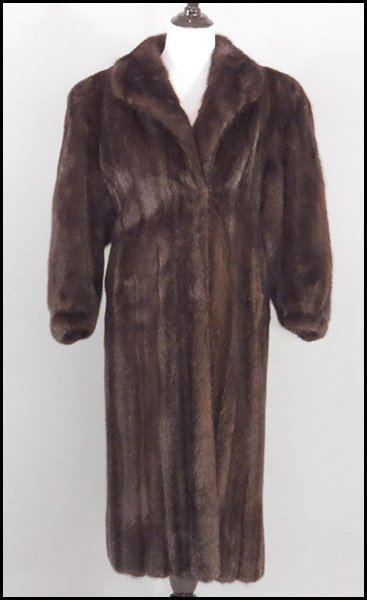 MAHOGANY MINK FULL-LENGTH COAT.: MAHOGANY MINK FULL-LENGTH COAT. With dolman sleeves and cinched cuffs. Labeled Schlampp's, Minneapolis, MN Size 10/12