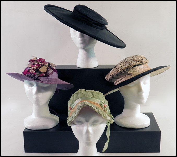 FOUR 1910'S HATS.: FOUR 1910'S HATS. Comprised of a black satin leghorn hat, a black and cream picture hat, a Caroline Adair Paris and New York woven tea hat, and a straw and bonnet form hat with the initials "U.T." Siz