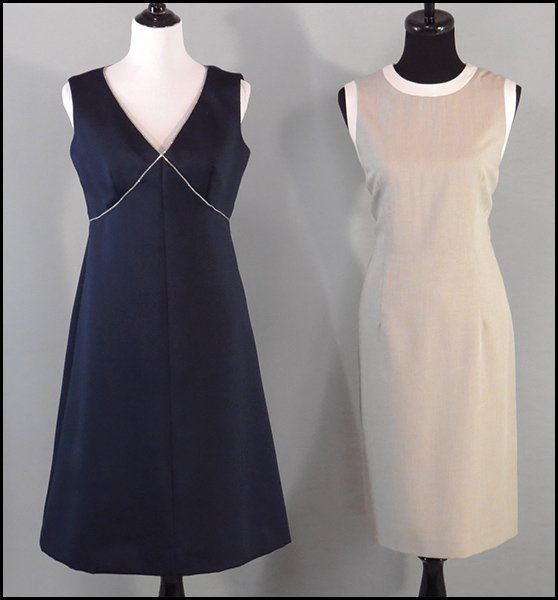 OLEG CASSINI WOOL BLEND A-LINE DRESS.: OLEG CASSINI WOOL BLEND A-LINE DRESS. Bearing two-tones and silk lining. Together with a navy silk dress, with a rhinestone neckline Size 12