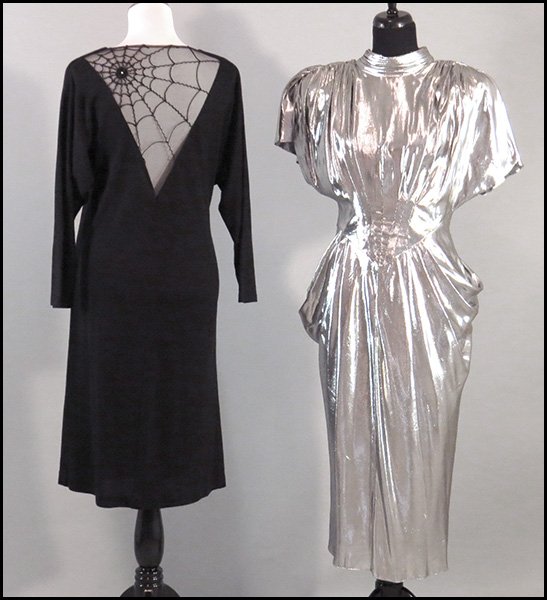 TWO 1980'S ERA DRESSES.: TWO 1980'S ERA DRESSES. Comprised of one silver polyester disco dress with a fitted front and one black knit dropwaist dress with a spider net front. Both unlabeled Size: Medium