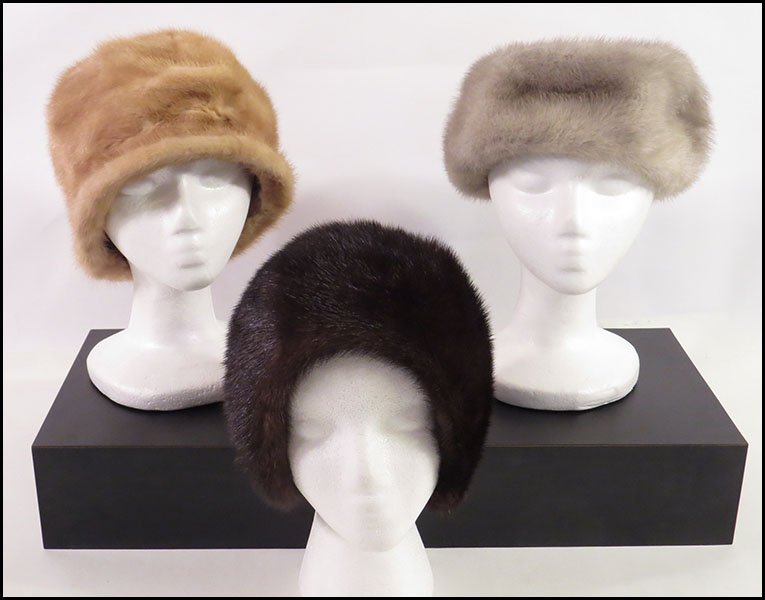 GROUP OF THREE MINK HATS.: GROUP OF THREE MINK HATS. Comprised of a gray Saks Fifth Avenue hat, a brown Amrose New York hat, and a tan Mantessa hat