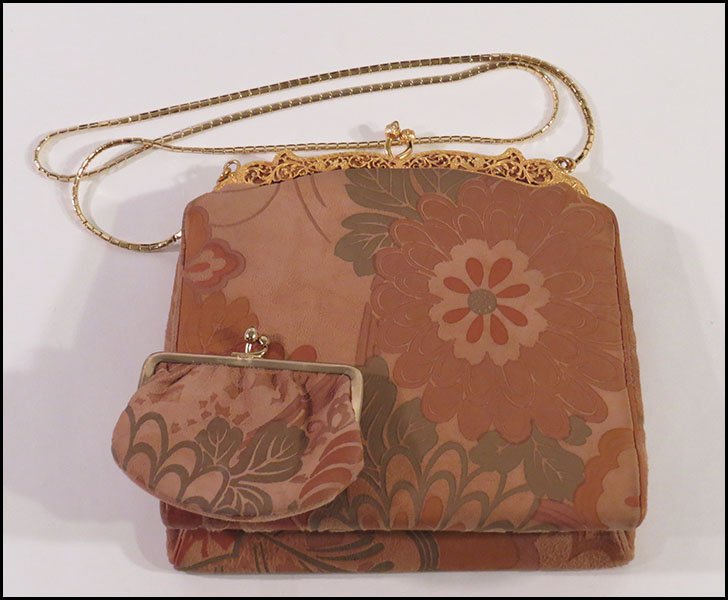 JUDITH LEIBER SUEDE EVENING BAG.: JUDITH LEIBER SUEDE EVENING BAG. Bearing a floral motif and a matching coin purse. Satin interior H: 7'' W: 6.5''