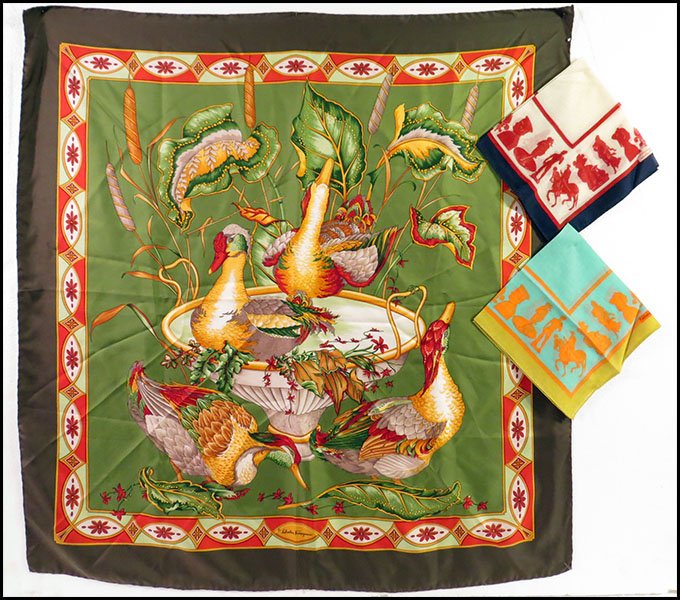 SALVATORE FERRAGAMO SILK SCARF.: SALVATORE FERRAGAMO SILK SCARF. Bearing a tropical bird motif, with cattails. Together with two Salvatore Ferragamo cotton handkerchiefs, bearing soldiers, horses, fleur-de-lis, and Grecian and Roman