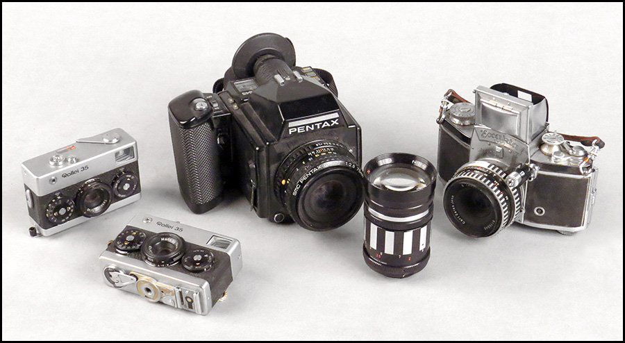 PENTAX 645 CAMERA.: PENTAX 645 CAMERA. No. 1049060. Reading Asahi Opt. Co, Japan, with a 75mm SMC Pentax-A lens. Together with an Exakta VX camera, with a 50mm Carl Zeiss Jena lens, no. 8176546 and an Exakta Spiratone 13