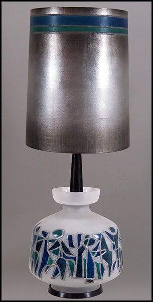 MID-20TH CENTURY GLASS TABLE LAMP.: MID-20TH CENTURY GLASS TABLE LAMP. In the artistic style of Marino Marini, depicting painted horses and riders Height to top of housing: 24" Diameter: 15"