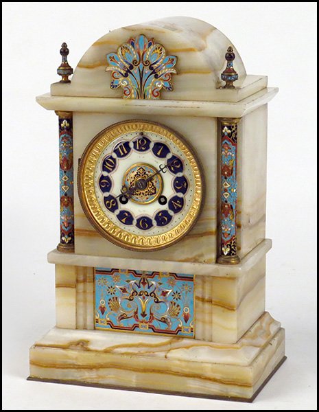 FRENCH ONYX AND CHAMPLEVE MANTLE CLOCK.: FRENCH ONYX AND CHAMPLEVE MANTLE CLOCK. Gilt surrounds the face with two champleve column forms on either side. The maker's name has worn off of the face 13" x 8.5" x 5"