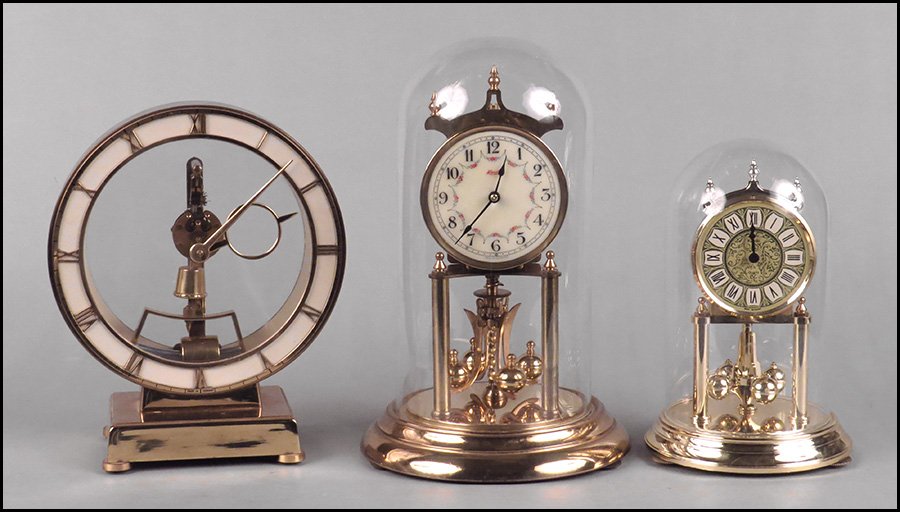 THREE KUNDO CLOCKS.: THREE KUNDO CLOCKS. Comprised of two anniversary clocks and a mantel clock. The smaller anniversay clock is quartz battery run Tallest height: 12"
