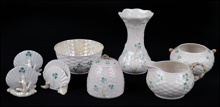 COLLECTION OF BELLEEK PORCELAIN TABLEWARES IN THE: COLLECTION OF BELLEEK PORCELAIN TABLEWARES IN THE SHAMROCK PATTERN. Comprised of three shell form card holders (2nd black mark), a honey pot and lid (2nd green mark), a waste bowl (3rd black mark), a 