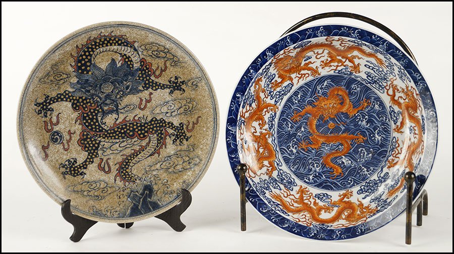 JAPANESE BLUE AND WHITE PORCELAIN CHARGER.: JAPANESE BLUE AND WHITE PORCELAIN CHARGER. Bearing dragon decoration and character marks on the underside. Together with a ceramic charger (diameter: 14.5") with faux crackle glaze and dragon decorati