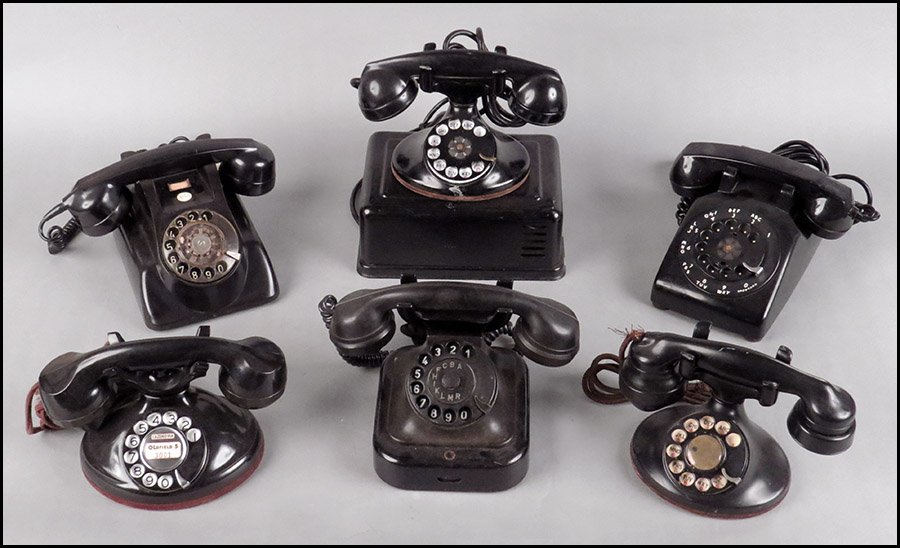 COLLECTION OF SIX ROTARY TELEPHONES.: COLLECTION OF SIX ROTARY TELEPHONES. Consisting of a bakelite desk phone, a metal and bakelite phone, a metal and plastic phone with ringer box, and three others Average: 5" x 9" x 8"