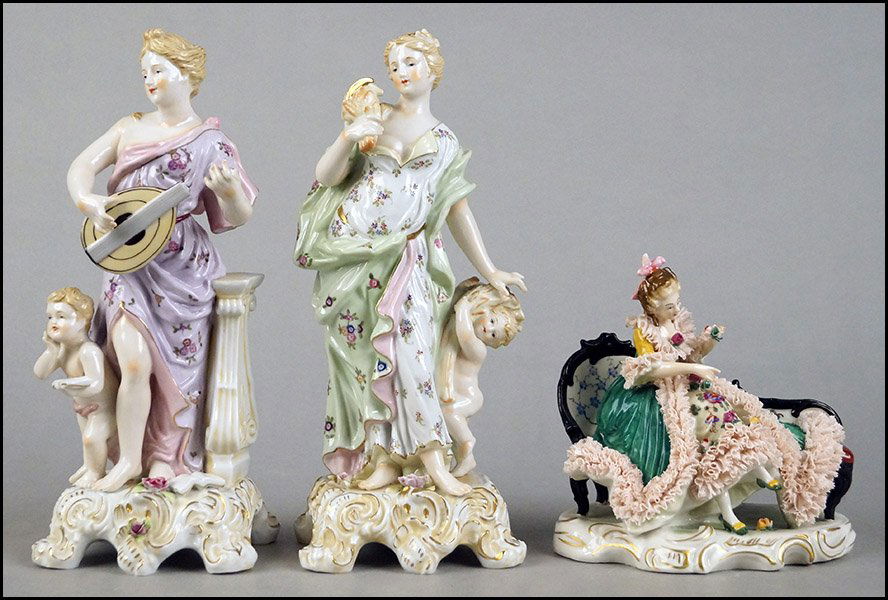 TWO PAINTED AND PARCEL GILT PORCELAIN FIGURAL GROUPS.: TWO PAINTED AND PARCEL GILT PORCELAIN FIGURAL GROUPS. Both of a woman and a child. Stamped "M-453." Together with a Capodimonte seated figure wearing a crinoline trimmed dress Tallest H: 11.25''