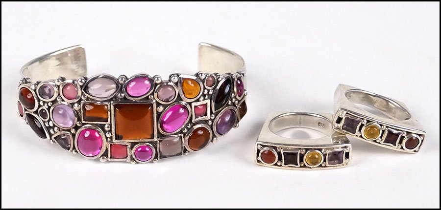 A PAIR OF GEM-SET STERLING SILVER RINGS.: A PAIR OF GEM-SET STERLING SILVER RINGS. Each set with amethyst, citrine, garnet, and carnelian. Together with a sterling silver and semi-precious stone bracelet