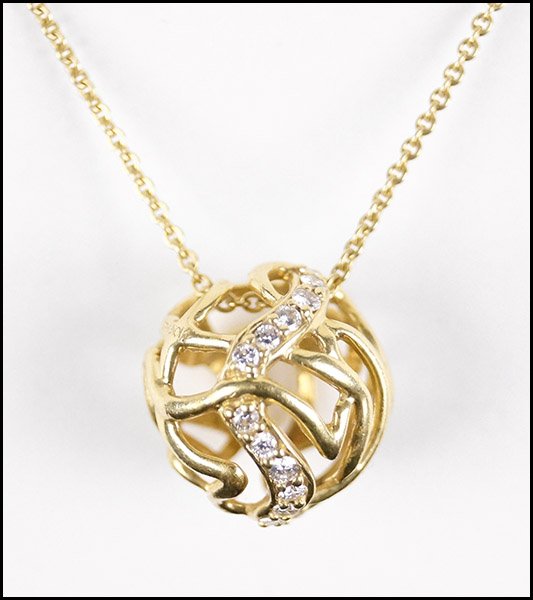AN 18 KT YELLOW GOLD AND DIAMOND PENDANT NECKLACE.: AN 18 KT YELLOW GOLD AND DIAMOND PENDANT NECKLACE. Pendant is signed 'Jose Hess' and is numbered '20073224' Length: 36" Wt: 10.3 grams