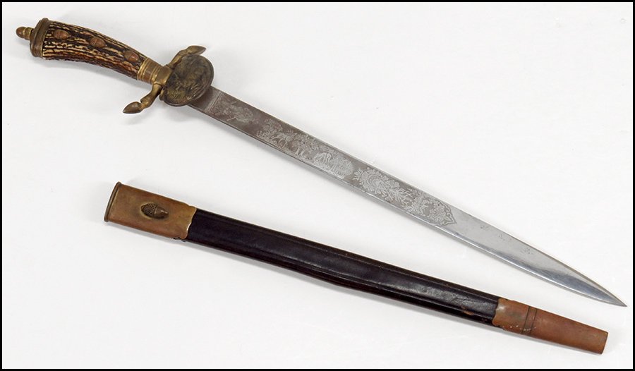 GERMAN NATIONAL HUNTING ASSOCIATION HIRSCHFANGER SWORD.: GERMAN NATIONAL HUNTING ASSOCIATION HIRSCHFANGER SWORD. Bearing a hunting motif on the blade and maker's mark "WK & C" with a king and knight head stamp. With a gilt metal cross-guard and hoove form e