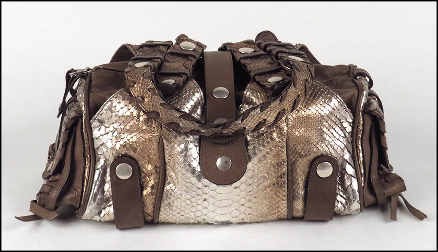 CHLOE SILVERADO PYTHON AND LEATHER SHOULDER BAG.: CHLOE SILVERADO PYTHON AND LEATHER SHOULDER BAG. Bearing whipstitching details on the handles and side pockets. With zipper and snap closures. Lined 13'' x 6.5'' x 6''