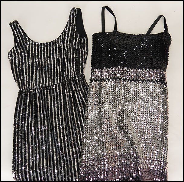 TWO BLACK AND SILVER SEQUINS DRESSES.: TWO BLACK AND SILVER SEQUINS DRESSES. One Bernshaw, made in England (size 8), with black velvet straps. One made in British Crown Colony, Hong Kong (size unlabeled)