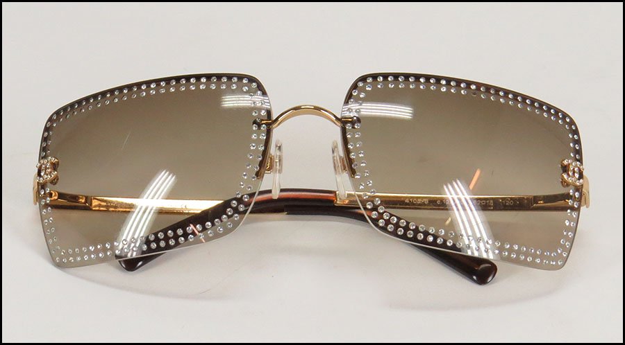 CHANEL SIGNATURE RHINESTONE SUNGLASSES.: CHANEL SIGNATURE RHINESTONE SUNGLASSES. Made in Italy. Bearing a brown tint. Stamped "Chanel" on the nosepiece. Women's