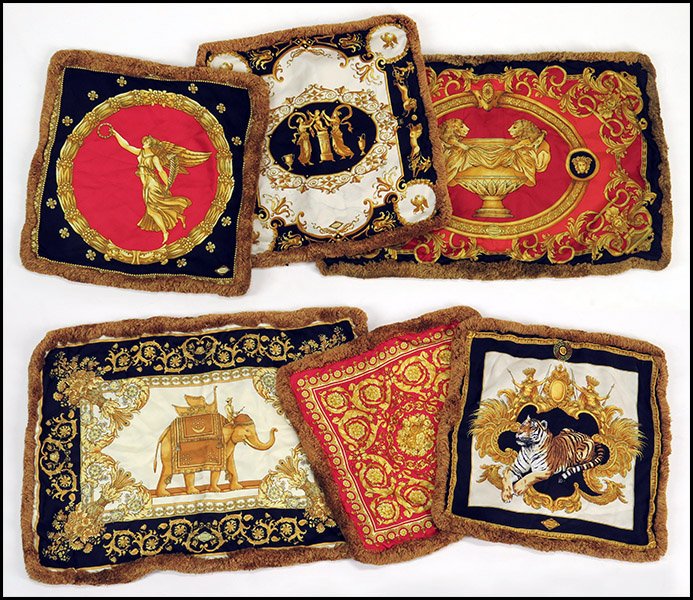 GROUP OF SIX GIANNI VERSACE SILK AND COTTON PILLOW: GROUP OF SIX GIANNI VERSACE SILK AND COTTON PILLOW SHAMS. Comprised of two rectangular pillow shams, one bearing an elephant, one bearing two lions surrouding an urn, and four square pillow shams depi
