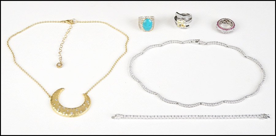 GROUP OF STERLING SILVER JEWELRY.: GROUP OF STERLING SILVER JEWELRY. Comprised of one faux turquoise ring, one ruby and cubic zirconia ring, one yellow rhinestone ring, one link bracelet, one necklace, and one hammered crescent necklac