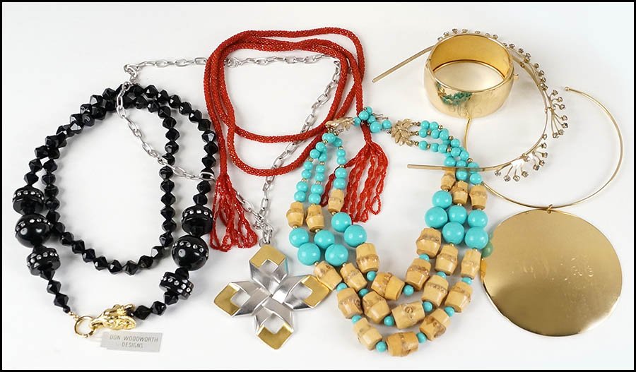 A TRIFARI BRUSHED WHITE AND YELLOW METAL PENDANT: A TRIFARI BRUSHED WHITE AND YELLOW METAL PENDANT NECKLACE. Together with a monogrammed cuff bracelet and pendant necklace, a red seed bead lariat necklace, a faux turquoise and wood triple-strand neck