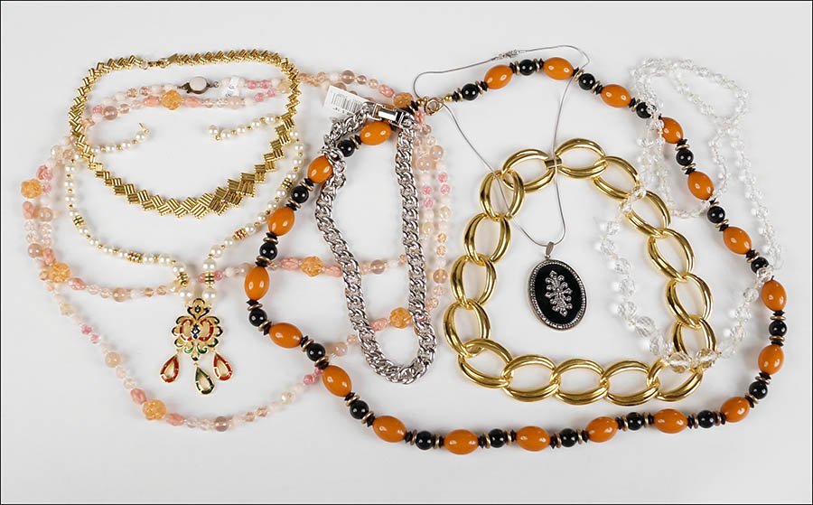 THREE NAPIER METAL LINK NECKLACES.: THREE NAPIER METAL LINK NECKLACES. Together with a Trifari faux pearl and enamel necklace, a pink and white bead necklace, a clear faceted glass bead necklace, a black pendant, and an orange and black