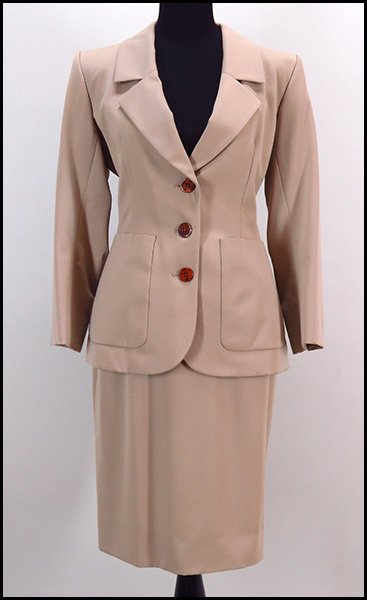 YVES SAINT LAURENT RIVE GAUCHE TWO-PIECE WOOL ENSEMBLE.: YVES SAINT LAURENT RIVE GAUCHE TWO-PIECE WOOL ENSEMBLE. Comprised of an a-line skirt and a blazer. With original tag. Lined. Made in France Size 42