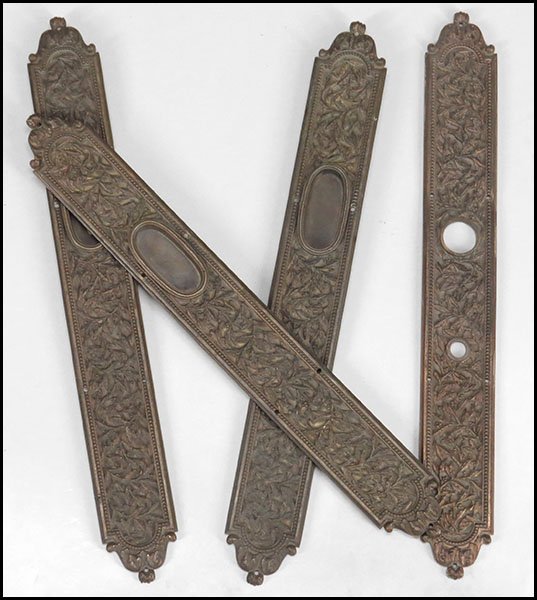 SET OF THREE BRONZE DOOR HARDWARE APPLIQUES.: SET OF THREE BRONZE DOOR HARDWARE APPLIQUES. Together with one bronze door hardware applique. All bear a foliate scroll design Each L: 19.75''