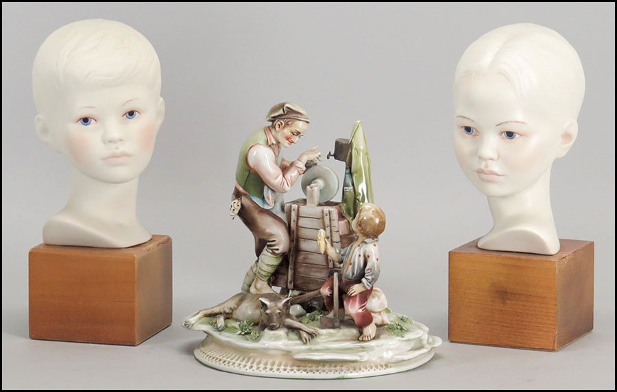 A BORSATO PORCELAIN FIGURAL GROUP.: A BORSATO PORCELAIN FIGURAL GROUP. "Sharpener's Audience." Numbered '950' with an 'A.Borsato' sticker and signature beneath. Made in Italy. Together with two Cybis porcelain busts, depicting child fig