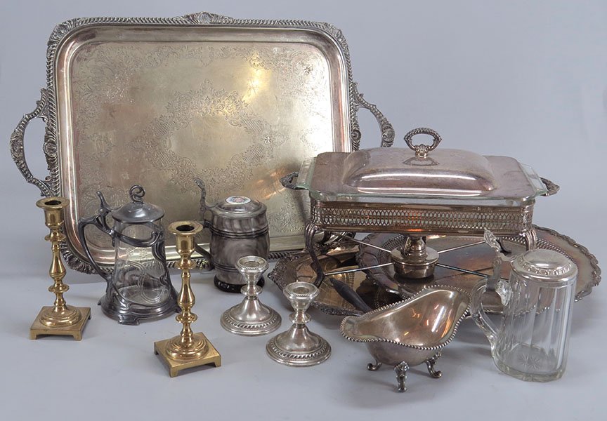 PAIR OF CREST SILVER COMPANY WEIGHTED STERLING CANDLEST: PAIR OF CREST SILVER COMPANY WEIGHTED STERLING CANDLESTICKS. Together with a collection of silverplate table articles including two serving trays, a covered serving dish with handles, two chafing dish