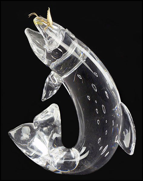 STEUBEN GLASS AND 18 KARAT GOLD 'TROUT AND FLY' FIGURE.: STEUBEN GLASS AND 18 KARAT GOLD 'TROUT AND FLY' FIGURE. Depicted with an attached lure and internal air bubbles. Signed beneath. Model 1002, designed for Steuben by James Houston in 1966 Height: 8''