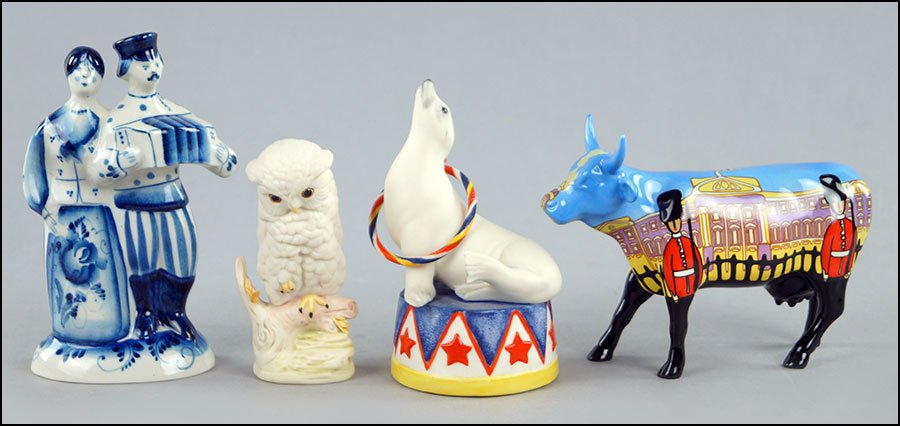 TWO CYBIS PORCELAIN FIGURES.: TWO CYBIS PORCELAIN FIGURES. One circus seal (5.5" x 4") and one perched owl (4.5" x 2.5"). Together with a Russian bluen and white glazed porcelain figure and a Cow Parade figure entitled, 'Bovingham